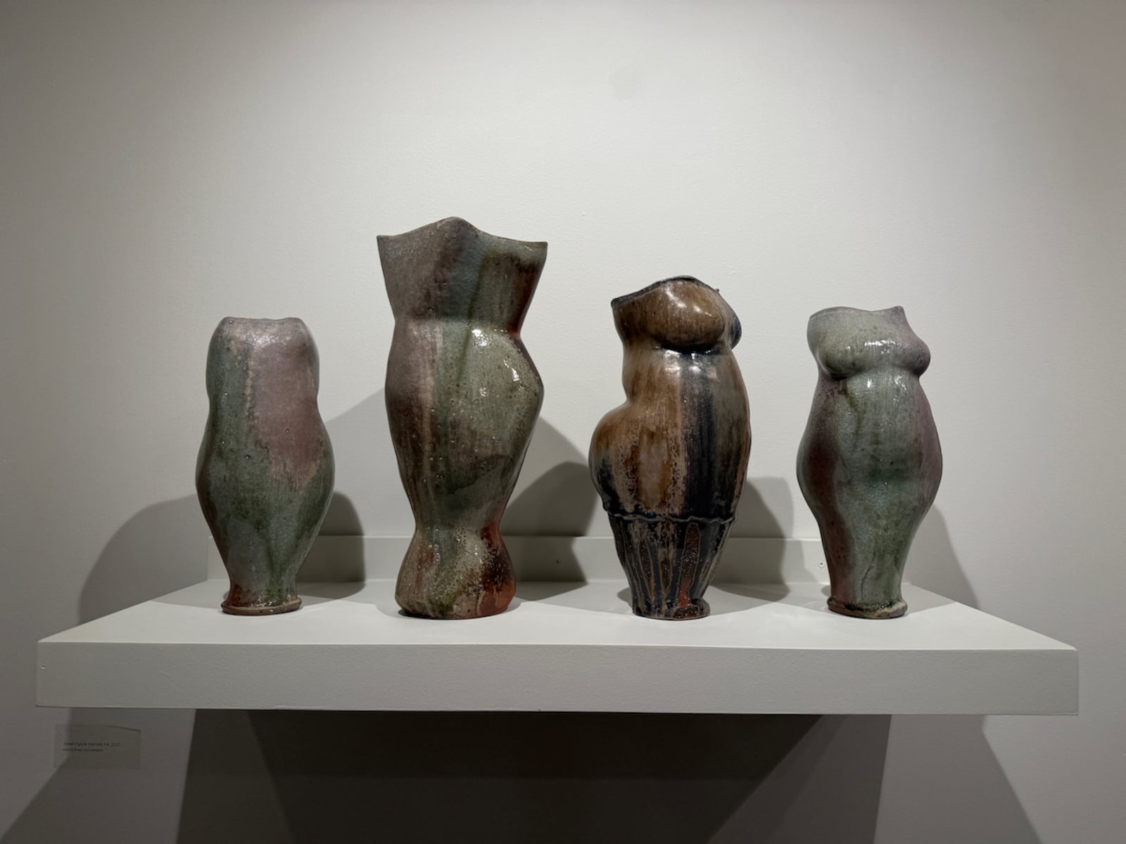 A collection of Denny Gerwin's "Small Figure Vessels", made of wood-fired stoneware. HANNAH KASPER/CONTRIBUTED