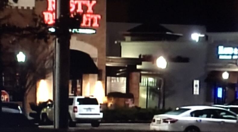 A suspicious package found attached to a car near the Rusty Bucket at the Dayton Mall in Miami Twp. Monday night caused an investigation by the Dayton Bomb Squad. STAFF