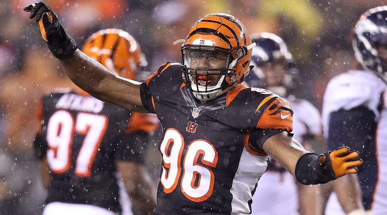 CINCINNATI, OH - DECEMBER 22: Carlos Dunlap #96 of the Cincinnati Bengals celebrates after sacking Peyton Manning #18 of the Denver Broncos during the fourth quarter at Paul Brown Stadium on December 22, 2014 in Cincinnati, Ohio. Cincinnati defeated Denver 37-28. (Photo by Andy Lyons/Getty Images)