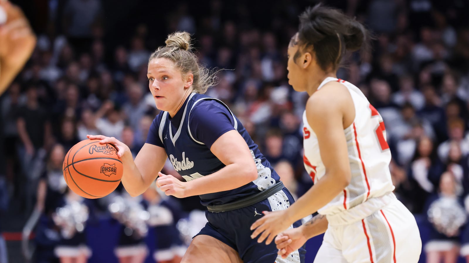 Fairmont senior forward Lena Buskard dribbles with pressure from Princeton's Heaven Sneed during the first half of the Division I state final on Saturday, March 14 at University of Dayton Arena. BRYANT BILLING / STAFF