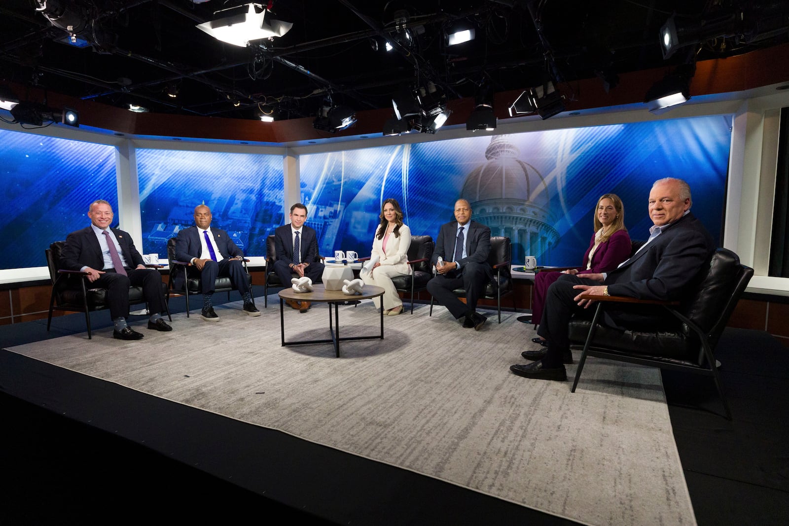FILE - From left, New Jersey Rep. Josh Gottheimer; Newark Mayor Ras Baraka; Jersey City Mayor Steve Fulop; moderator NJ Spotlight News anchor Briana Vannozzi; moderator WNYC Morning Edition host Michael Hill; New Jersey Rep. Mikie Sherrill; and former state Senate President Steve Sweeney attend the New Jersey Democratic gubernatorial primary debate Monday, May 12, 2025, in Newark, N.J. (Steve Hockstein/NJ Advance Media via AP, Pool, File)