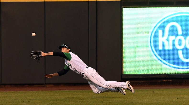Dayton left fielder Stuart Fairchild dives for a line drive during Friday night’s game at Fifth Third Field. Fairchild made the catch on the play. Nick Falzerano/CONTRIBUTED