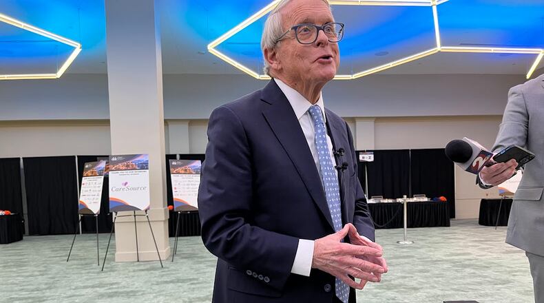Ohio Gov. Mike DeWine speaks after his public remarks at the Dayton Development Coalition's annual meeting at the Dayton Convention Center Wednesday. THOMAS GNAU/STAFF