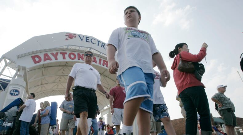 Air Show fans enjoyed touring the displays in 2008 at the Vectren Dayton Air Show after coming through the main entrance. STAFF PHOTO BY TY GREENLEES