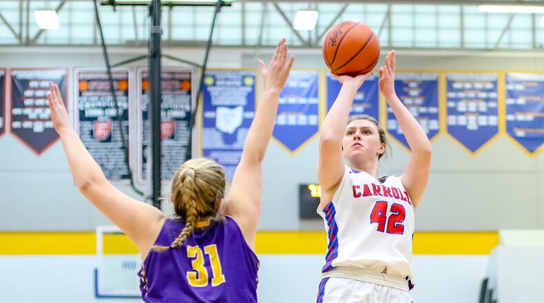Carroll’s Julia Keller shoots the ball over Eaton’s Becca Mowen during their Division II sectional final game on Monday night at Springfield High School. The Patriots won 65-30. CONTRIBUTED PHOTO BY MICHAEL COOPER