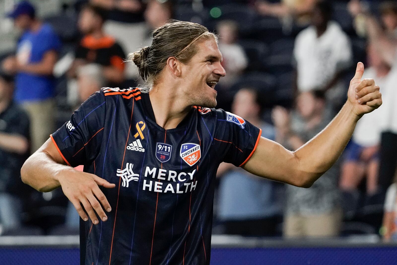 FC Cincinnati defender Nick Hagglund gestures to fans after defeating Toronto FC Saturday, Sept. 11, 2021, in Cincinnati. (AP Photo/Jeff Dean)