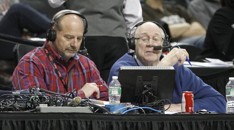 WHIO’s Larry Hansgen, left, and Bucky Bockhorn broadcast the Flyers’ victory over Fordham in the second round of the A-10 tournament on Thursday, March 13, 2014, at the Barclays Center in Brooklyn, N.Y. David Jablonski/Staff