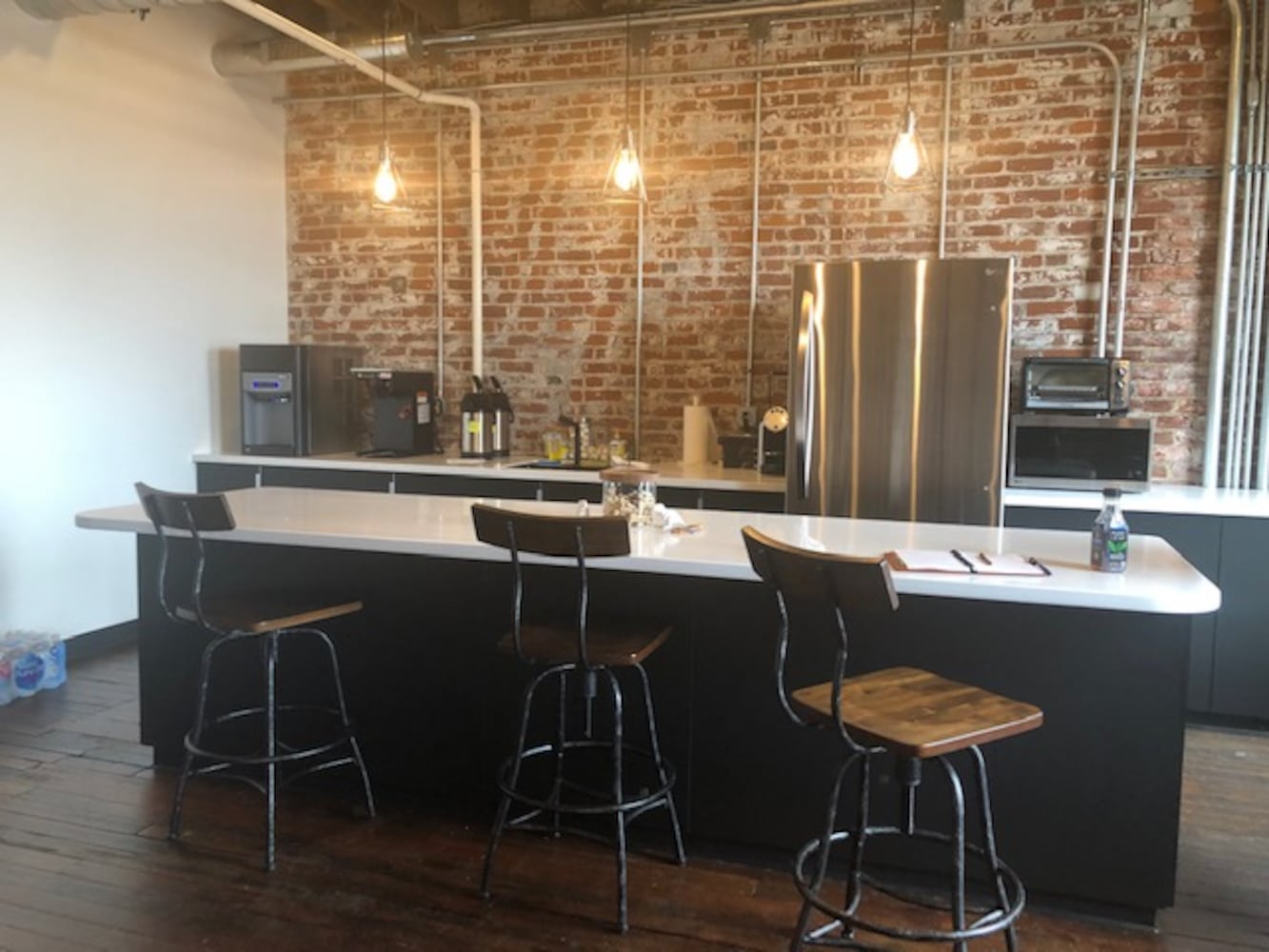 PHOTOS: Inside the new downtown Dayton office that has an industrial slide