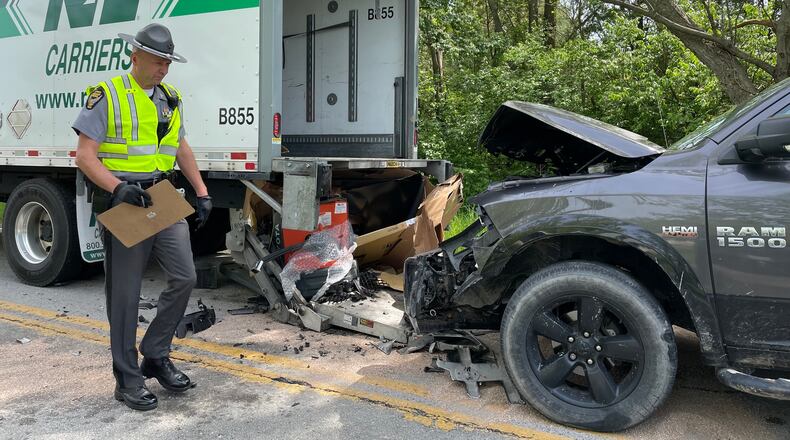 A man delivering a large flat-screen TV was struck by a pickup truck Tuesday, May 10, 2022, while he was standing behind a box truck on Enon Road in New Carlisle. BILL LACKEY/STAFF