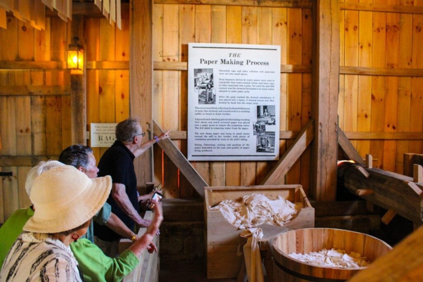 Patrons enjoy the history presented inside the Mad River Pulp & Paper exhibit at Carillon Historical Park. CONTRIBUTED