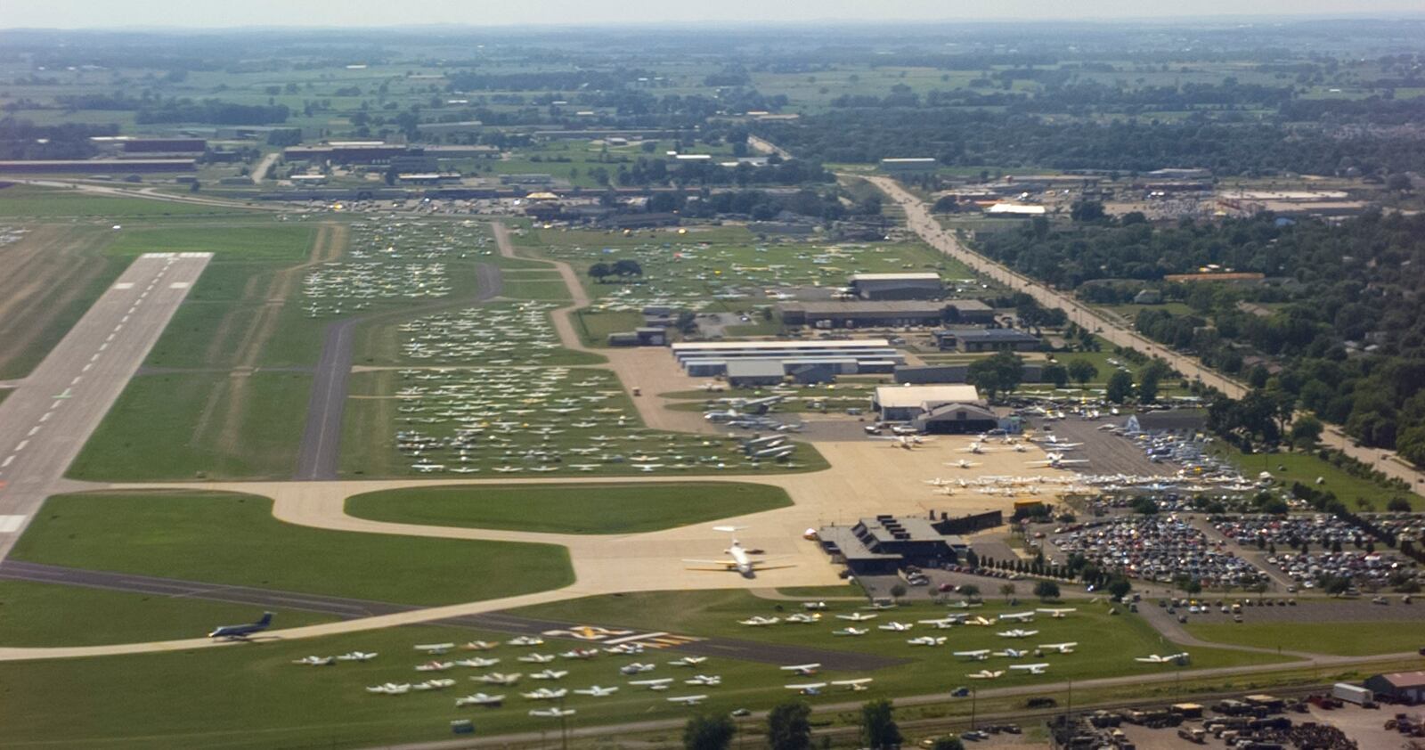 Thousands of airplanes fill the Whitman Regional Airport in Oshkosh, Wisconsin for the Annual Experimental Aircraft Association Convention - 1997