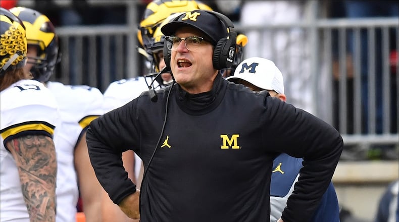 COLUMBUS, OH - NOVEMBER 26: Head coach Jim Harbaugh of the Michigan Wolverines argues a call on the sideline during the second half against the Ohio State Buckeyes at Ohio Stadium on November 26, 2016 in Columbus, Ohio. (Photo by Jamie Sabau/Getty Images)