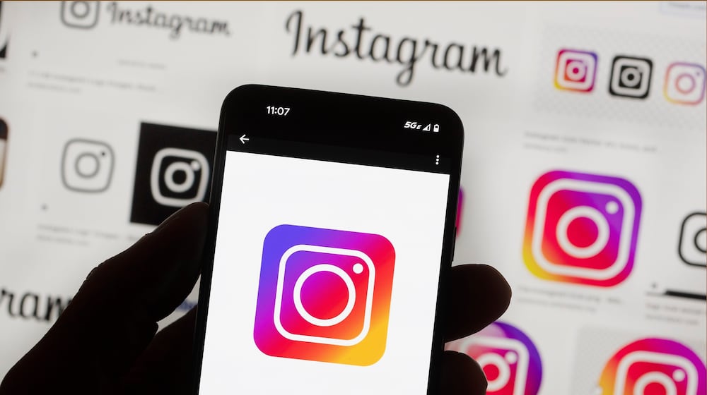 FILE - The Instagram logo is seen on a cell phone in Boston, Oct. 14, 2022. (AP Photo/Michael Dwyer, File)