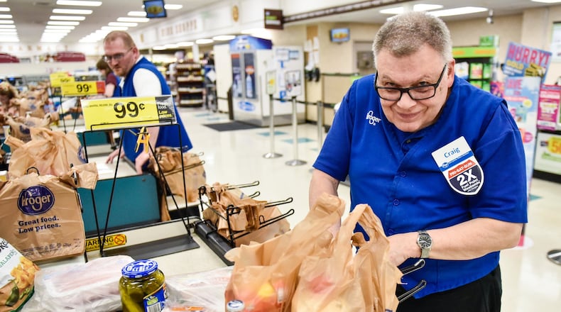 Craig Gordon, 75, a West Chester Twp. man with special needs, bags groceries at Kroger on Ohio 747 in West Chester Twp.Gordon has worked there for nearly two decades and is retiring. NICK GRAHAM/STAFF