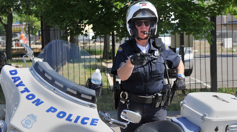 Dayton police Officer Dyan Thomas urged motorsits to keep an eye out for motorcyclsts and also asked motorcyclists to drive defensively as temperatures warm up. STAFF PHOTO / MARSHALL GORBY
