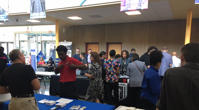 High school students and employers interact at the Ponitz Career Tech Center career fair in Dayton. JEREMY P. KELLEY / STAFF