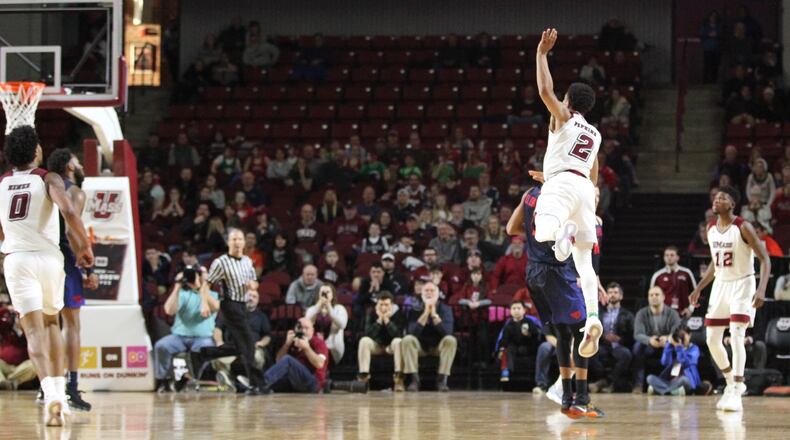 Massachusetts guard Luwane Pipkins makes a go-ahead 3-pointer with 55 seconds left against Dayton on Saturday, Feb. 3, 2018, at the Mullins Center in Amherst, Mass. David Jablonski/Staff