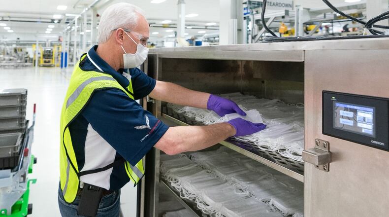Engineers and technicians set-up and test the machines that will be used to manufacture Level 1 face masks Monday, March 30, 2020 at the General Motors Warren, Michigan manufacturing facility. Production will begin next week and within two weeks ramp up to 50,000 masks per day, with the potential to increase to 100,000 per day. (Photo by John F. Martin for General Motors)