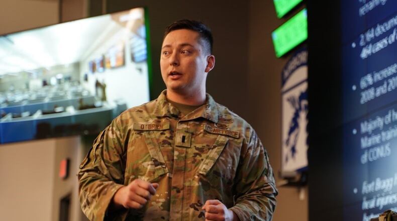 First Lt. Justin O’Brien, assigned to the 88th Air Base Wing at Wright-Patterson Air Force Base, presents his idea for a battery-operated, water-cooled plate carrier system during Dragon's Lair on Dec 6. O'Brien's design helps keep service members up to 30 degrees Fahrenheit cooler in hot and humid conditions. CONTRIBUTED PHOTO/ARMY SGT. MARYGUAN BARNES