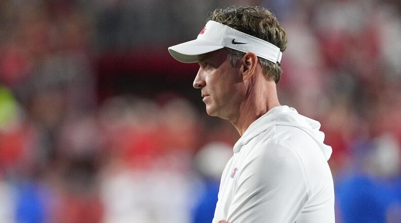 Mississippi head coach Lane Kiffin, watches his team warm up prior to the start of an NCAA college football game against Florida, Saturday, Nov. 15, 2025, in Oxford, Miss. (AP Photo/Rogelio V. Solis)