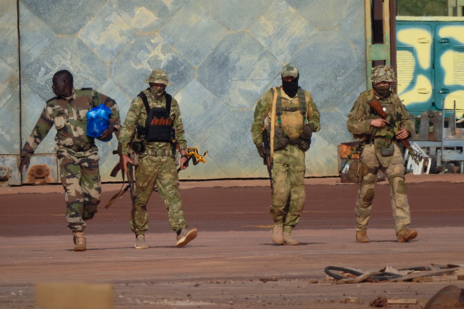 FILE - This undated photograph handed out by the French military shows three Russian mercenaries, right, in northern Mali. (French Army via AP)