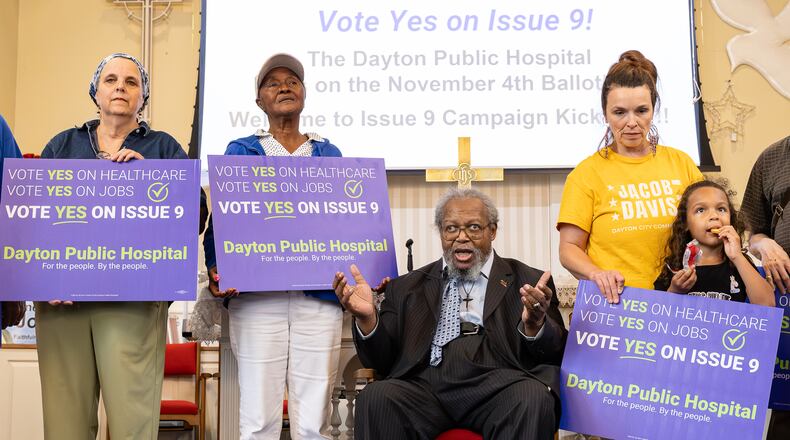 Volunteers listen as Bishop Richard Cox, president of the Clergy Community Coalition, speaks during a meeting for volunteers pushing for the passage of Issue 9, a tax levy measure in support of a new public hospital in West Dayton. The meeting was held Tuesday, Sept. 23 at College Hill Community Church in Dayton in western Dayton. BRYANT BILLING / STAFF