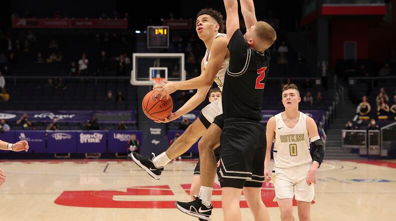Botkins High School senior Jayden Priddy-Powell drives into Columbus Grove's Blake Reynolds during the Division IV state championship on Sunday morning at UD Arena. Michael Cooper/CONTRIBUTED