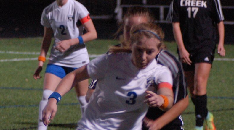 Springboro’s Alix Rigano controls the ball as a Beavercreek defender applies pressure during their Division I regional semifinal last week at Fairmont Park Stadium. Springboro won 1-0. JOHN CUMMINGS/CONTRIBUTED