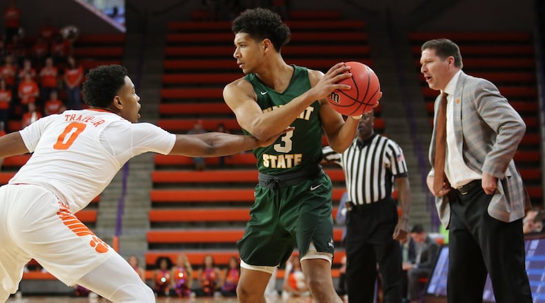 Clemson’s Clyde Trapp (2) guards Wright State’s Mark Hughes (3) as Clemson coach Brad Brownell watches during Tuesday night’s NIT game at Littlejohn Coliseum in Clemson, S.C. Clemson won 75-69. PHOTO COURTESY OF CLEMSON ATHLETICS