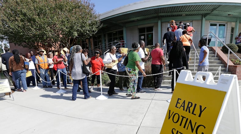 FILE - In this Oct. 20, 2016 file photo ,voters line up during early voting at Chavis Community Center in Raleigh, N.C. More than a dozen states have enacted tougher requirements for registering and voting since the U.S. Supreme Court overturned a key provision of the Voting Rights Act three years ago. That has led to confusion and claims that certain groups, mostly minorities who tend to vote with Democrats, are being disenfranchised. (AP Photo/Gerry Broome, File)