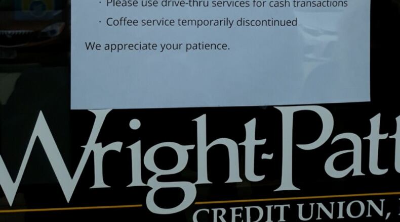 A note on the door of a local Wright-Patt Credit Union branch.