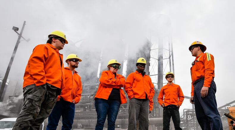 Harlan Taylor, right, leads a tour of the blast furnace at AK Steel Nov. 16 in Middletown. NICK GRAHAM/STAFF