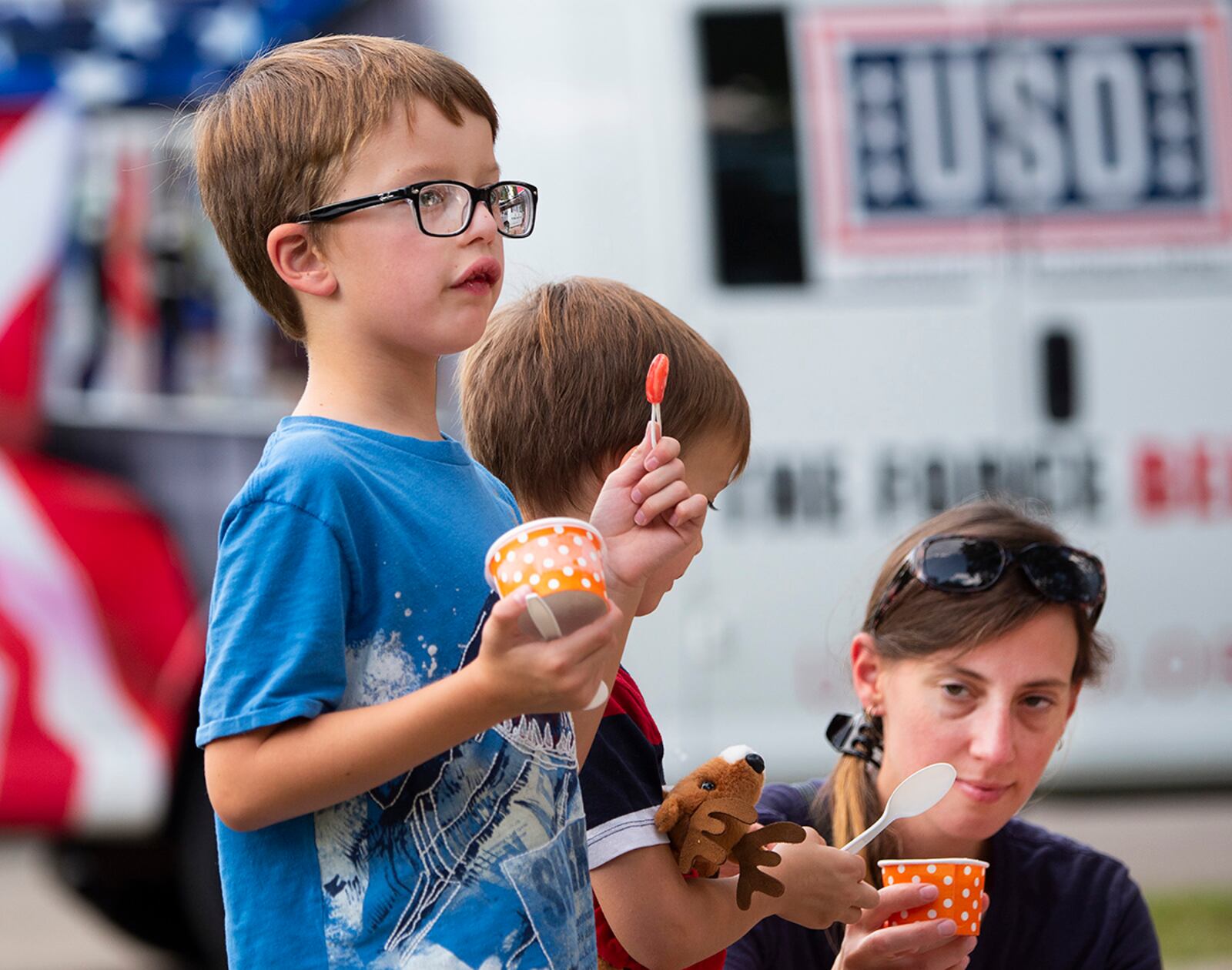 Tanya Collie, along with her sons Nathaniel, 9, and Noah, 6, have ice cream at the Women’s Equality Day event Aug. 27 on Wright-Patterson Air Force Base. U.S. AIR FORCE PHOTO/R.J. ORIEZ