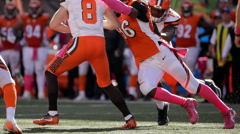 CINCINNATI, OH - OCTOBER 23: Kevin Hogan #8 of the Cleveland Browns is sacked by Carlos Dunlap #96 of the Cincinnati Bengals during the third quarter at Paul Brown Stadium on October 23, 2016 in Cincinnati, Ohio. (Photo by Andy Lyons/Getty Images)