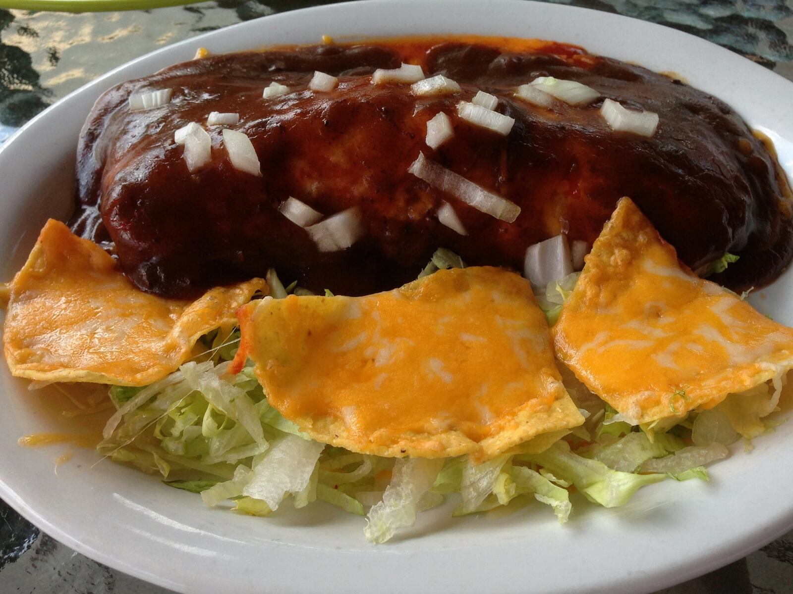 Behold, the burralada. This is a Carmel’s Southwest & Mexican Grill’s original creation (think burrito plus enchilada). It starts with slow-cooked, marinated sirloin and beans that are wrapped in a flour tortilla, then topped with cheese, onions and a brown gravy made with red wine. (Staff photo by Connie Post)