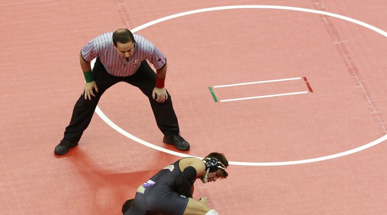 Kaleb Romero of Mechanicsburg (black) wrestles Sean Netherton of Williamsport Westfall (grey) at 170 lbs. in Division III during Thursday’s OHSAA championship wrestling tournament at Value City Arena in Columbus on March 9, 2017. Barbara J. Perenic/The Columbus Dispatch