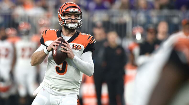MINNEAPOLIS, MN - DECEMBER 17: AJ McCarron #5 of the Cincinnati Bengals looks to pass the ball in the fourth quarter of the game against the Minnesota Vikings on December 17, 2017 at U.S. Bank Stadium in Minneapolis, Minnesota. (Photo by Hannah Foslien/Getty Images)