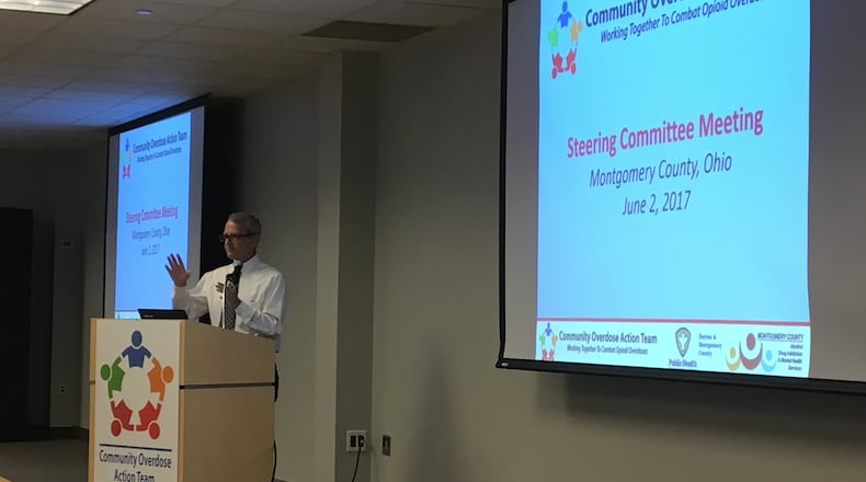 Montgomery County Commissioner Dan Foley kicks off a meeting of the Community Overdose Action Team steering committee at the Business Solutions Center, Friday, June 2, 2017.
