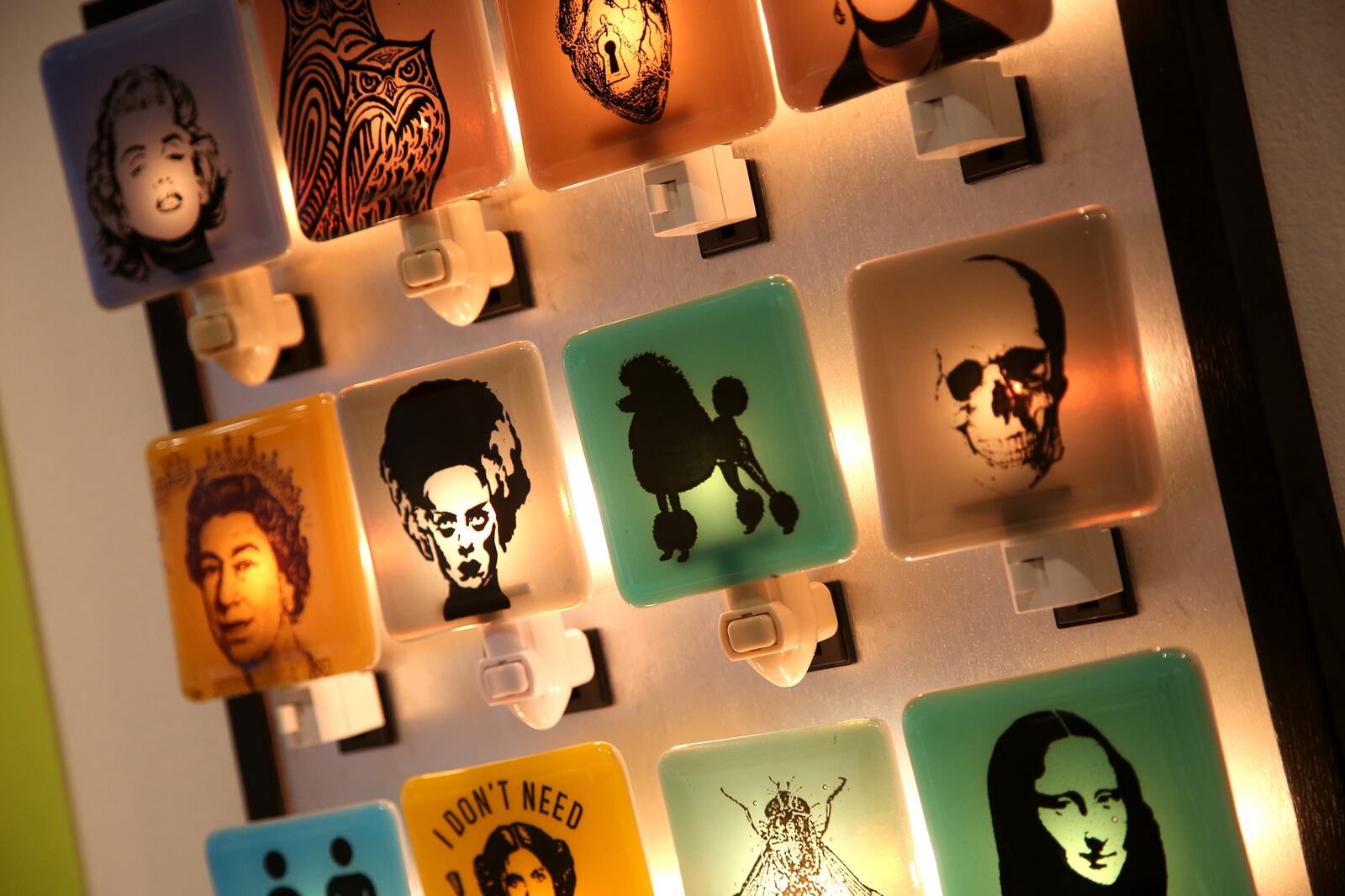 Night lights made by Kevin Tunstall feature a variety of images including the Mona Lisa, a skeleton and a poodle. The lights are $26. LISA POWELL / STAFF