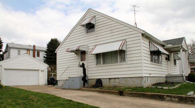 The property has a 2-car garage with electronic opener and heating. The concrete driveway also acts as a backyard patio.