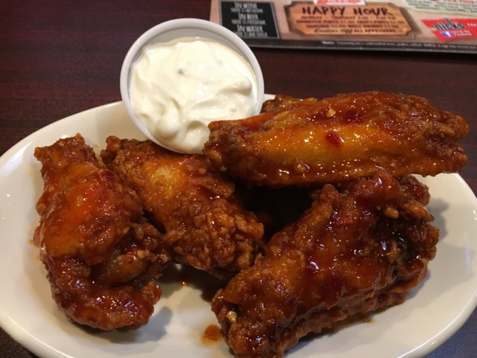 Nick's hand flours all of its wings and has a line of sauces that pack a punch. JIM INGRAM/STAFF
