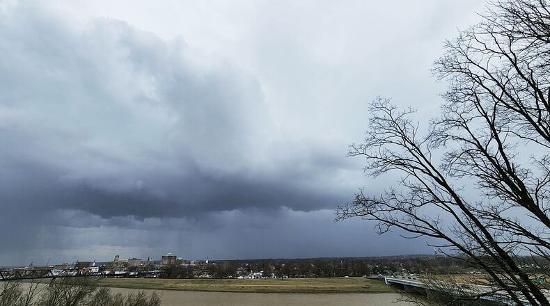 Dark clouds could be seen in Hamilton while Butler County was under a severe thunderstorm warning Wednesday afternoon, March 23, 2022, for a line of strong storms that moved through the region. NICK GRAHAM / STAFF