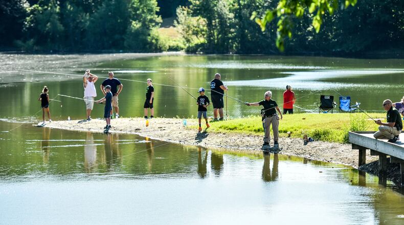 More than 30 children attended the Fish with a Cop event Tuesday, July 17, at Fairfield Optimist Club pond. Butler County Sheriff’s Office employees helped the youth during the event. Supplies were donated by Hamilton Bait & Tackle, Dixie Marine and Bass Pro Shop. NICK GRAHAM/STAFF
