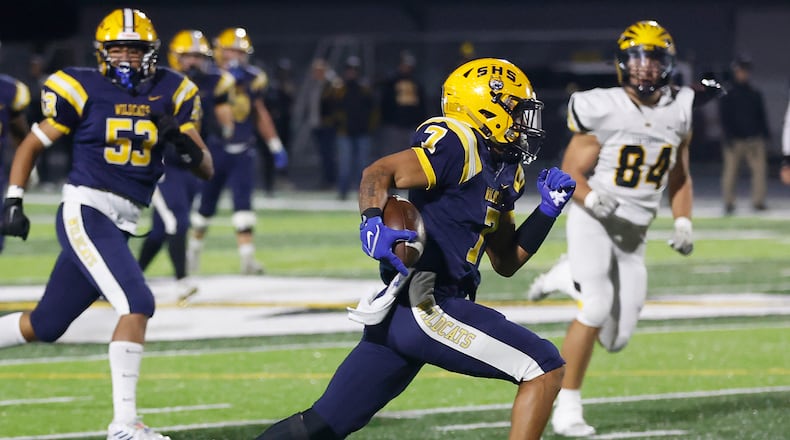 Springfield's Anthony Brown rushes for a Wildcats' touchdown against Centerville during Friday's playoff game. BILL LACKEY/STAFF