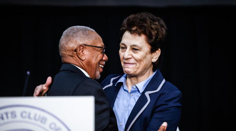 Retired Air Force office Cassie Barlow is congratulated Thursday, Oct. 5, 2023 by Dayton Mayor Jeffrey Mims Jr. for being named the Citizen Legion of Honor award winner for 2023.