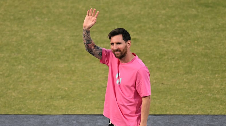 Argentinia's soccer star Lionel Messi waves to fans during his India tour in New Delhi, India, Monday, Dec. 15, 2025. (AP Photo)
