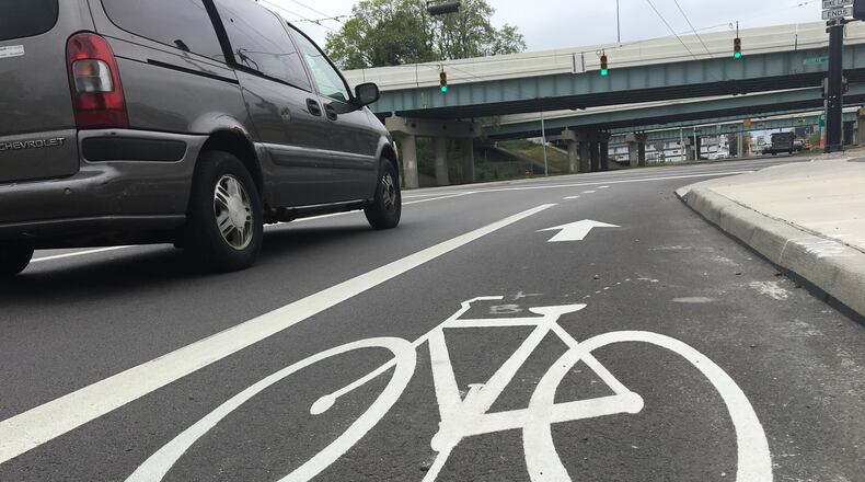 The bike lane at Warren Street, headed north, ends right before the U.S. 35 overpass. Next year, the city plans to extend the path up to Jefferson Street, to connect with an existing lane. CORNELIUS FROLIK / STAFF