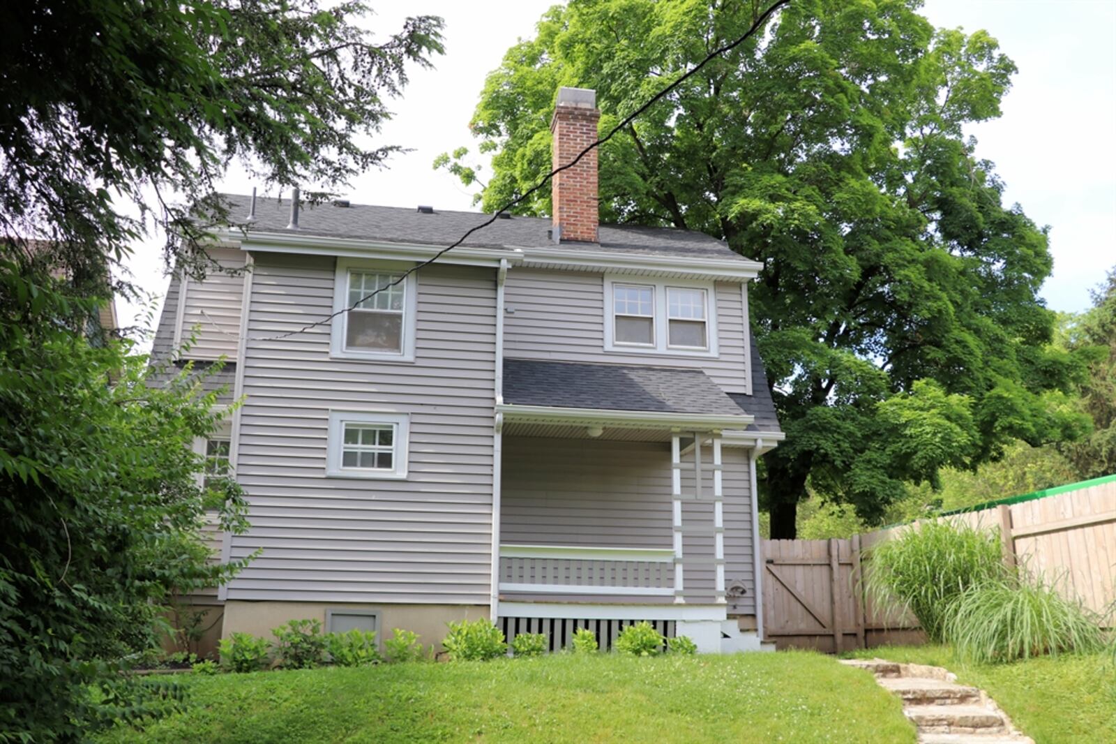 Located on the west side of Kettering, the home sits on a corner lot with a wooden privacy fence surrounding the terraced backyard. 