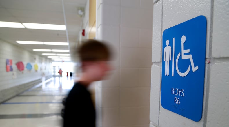 Public schools must permit transgender students to use bathrooms and locker rooms consistent with their chosen gender identity, according to an Obama administration directive issued amid a court fight between the federal government and North Carolina. BILL LACKEY / STAFF
