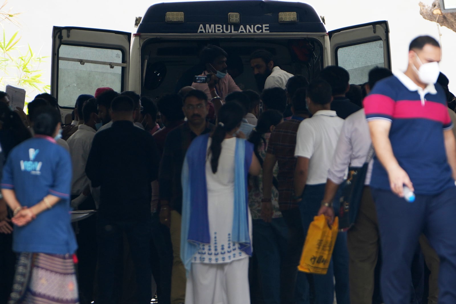 An ambulance transport the body of the victims of Thursday's Air India plane crash at a hospital in Ahmedabad, India, Sunday, June 15, 2025. (AP Photo/Ajit Solanki)